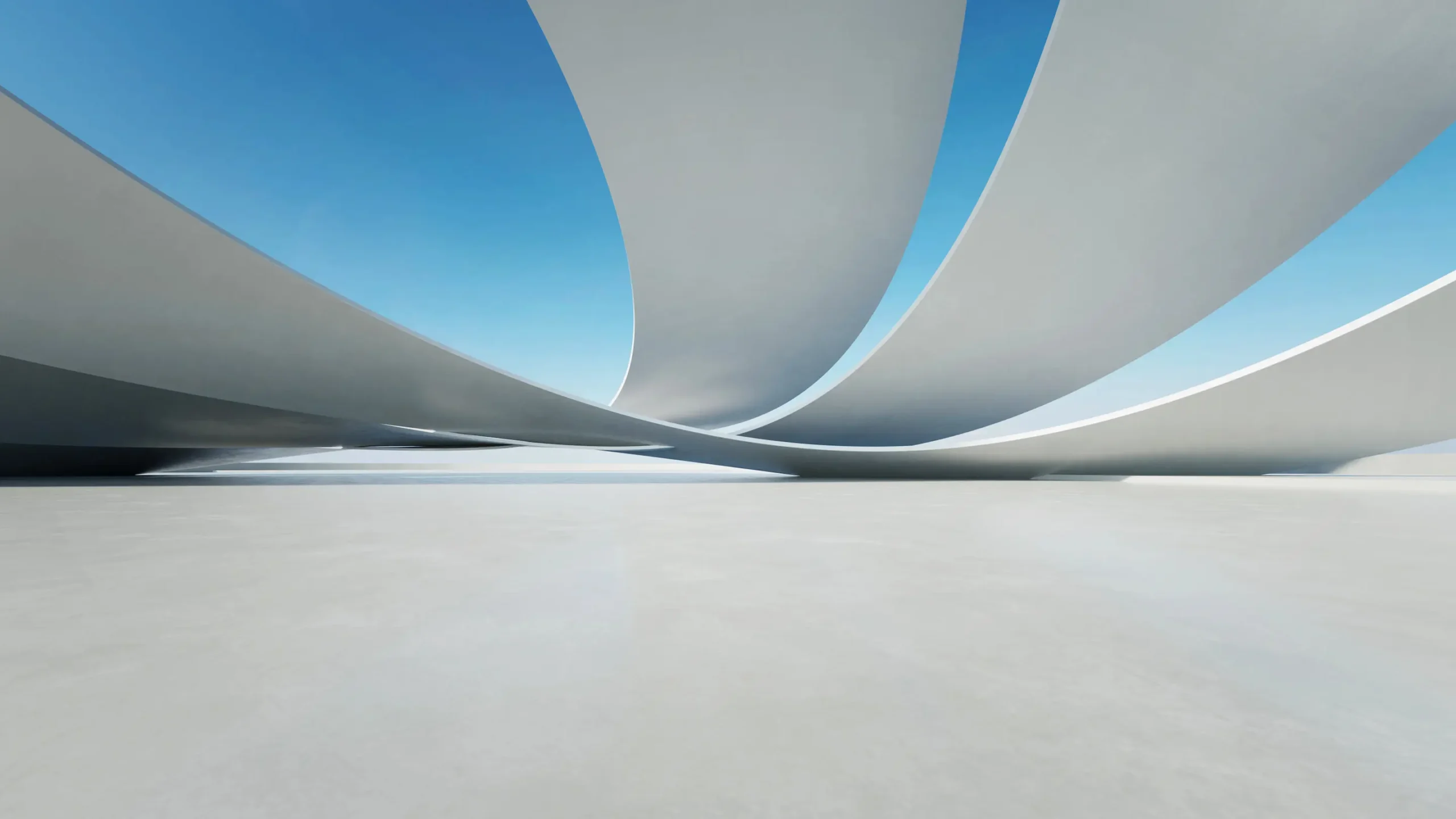 White sweeping architectural forms with a calm blue sky